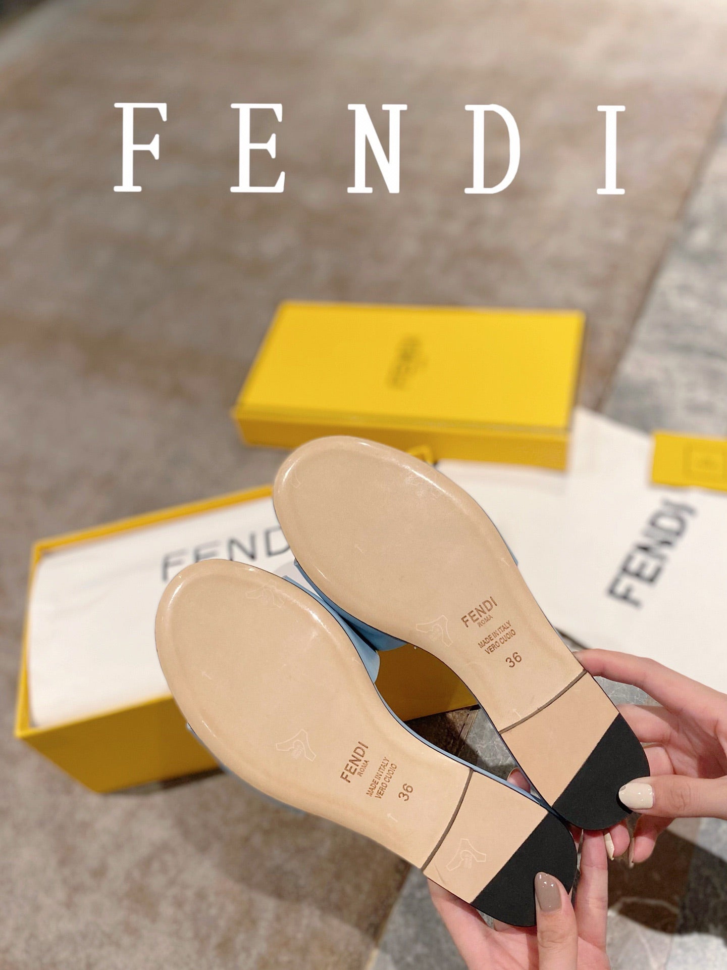 FENDI BAGUETTE SLIDES IN BABY BLUE LAMBSKIN