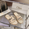 WOODY SLIPPER IN BEIGE MIX BLACK CANVAS