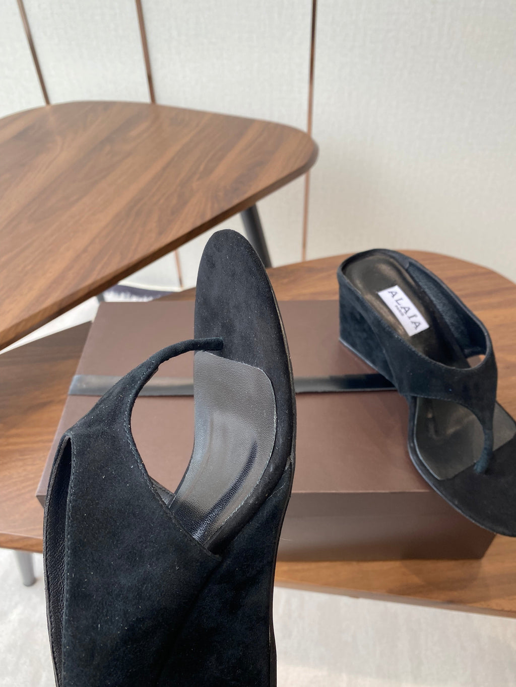 ALAIA WEDGE THONG SANDALS 25S IN BLACK SUEDE