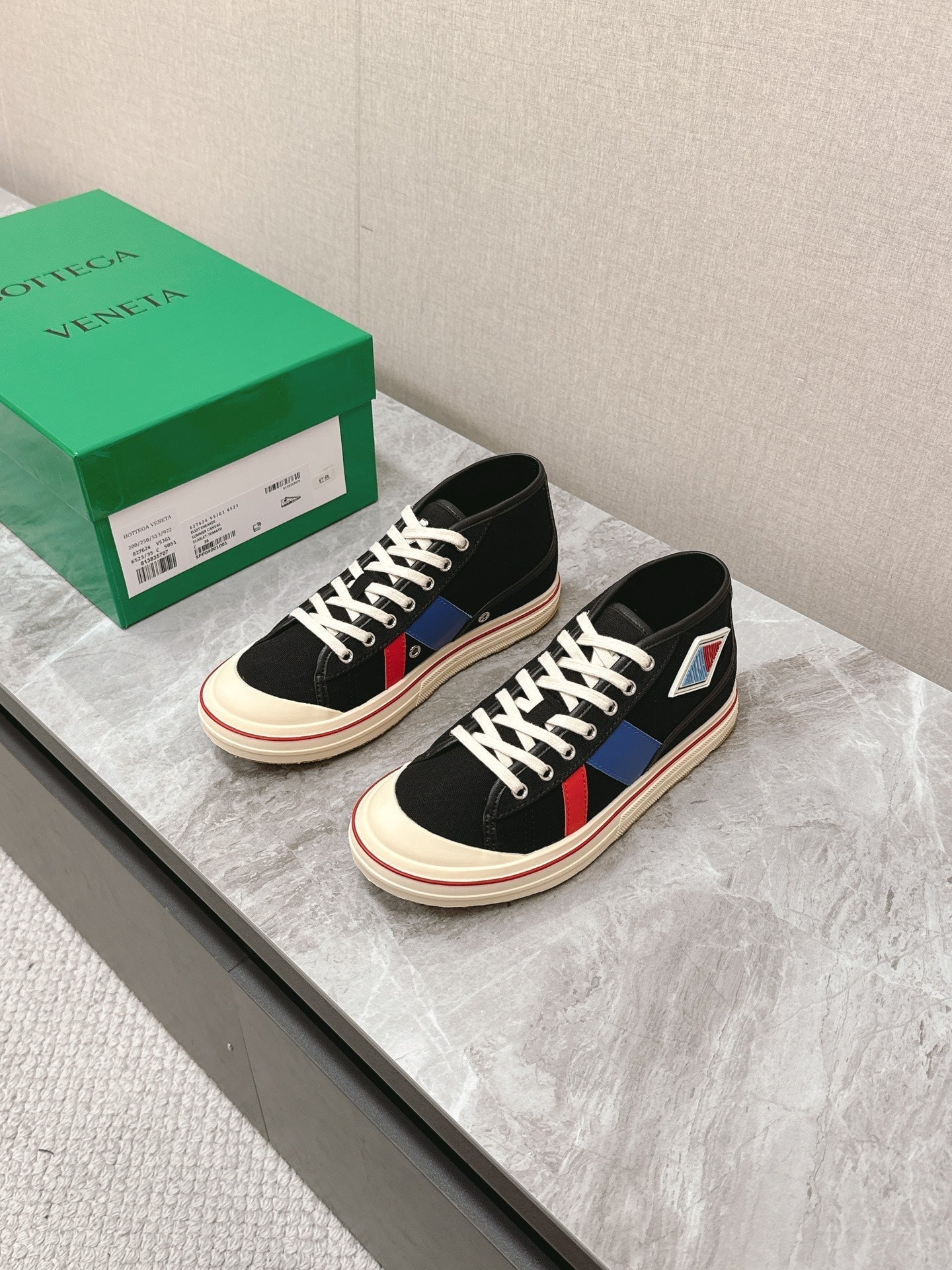 BOTTEGA VENETA ELIOT SNEAKER IN BLACK MIX BLUE AND RED CANVAS AND CALFSKIN