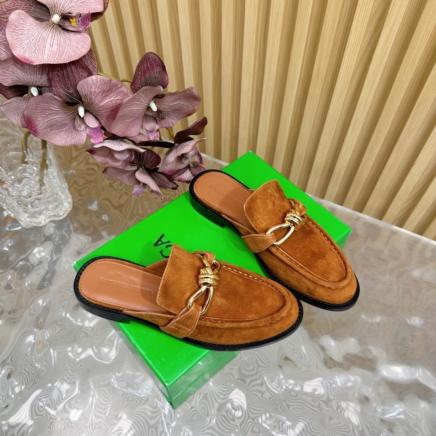 BOTTEGA VENETA OPEN-BACK LOAFER REALISED IN CINNAMON BROWN SUEDE WITH SIGNATURE METALLIC KNOT DETAIL