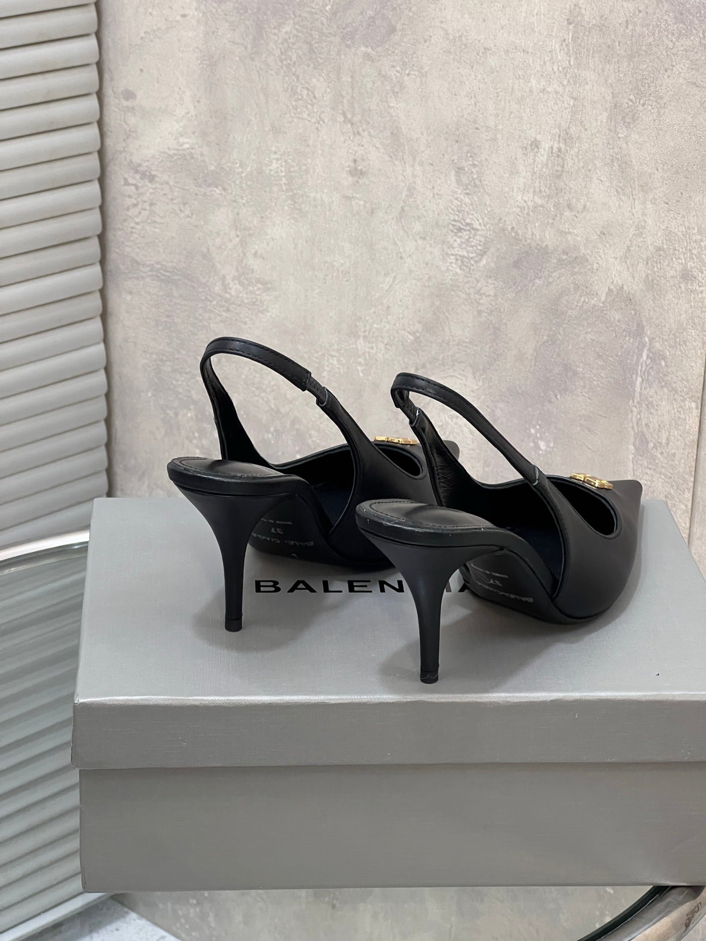 BALENCIAGA 25S HIGH-HEEL SLINGBACK 85 MM IN BLACK COW LEATHER WITH GOLD HARDWARE