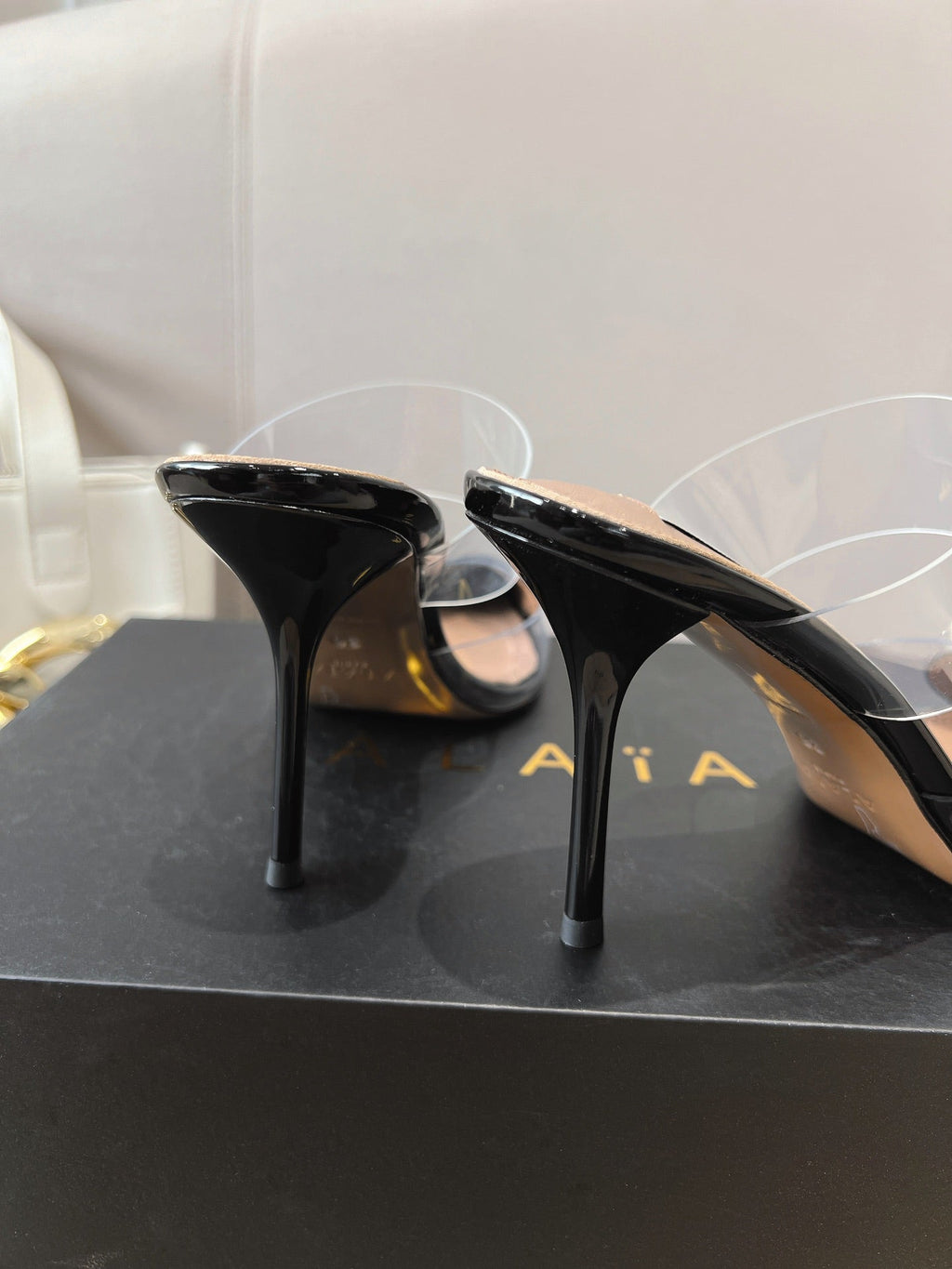 ALAIA HIGH MULES IN BLACK PATENT CALFSKIN AND FILM
