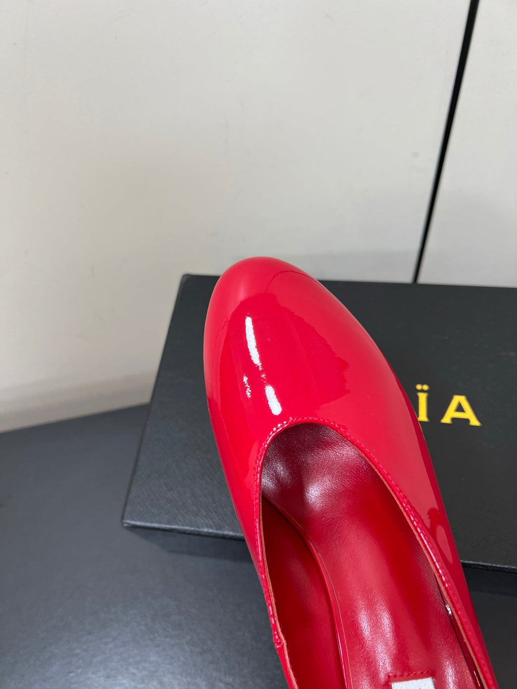 ALAIA WEDGE MULES 25S IN RED LAMBSKIN