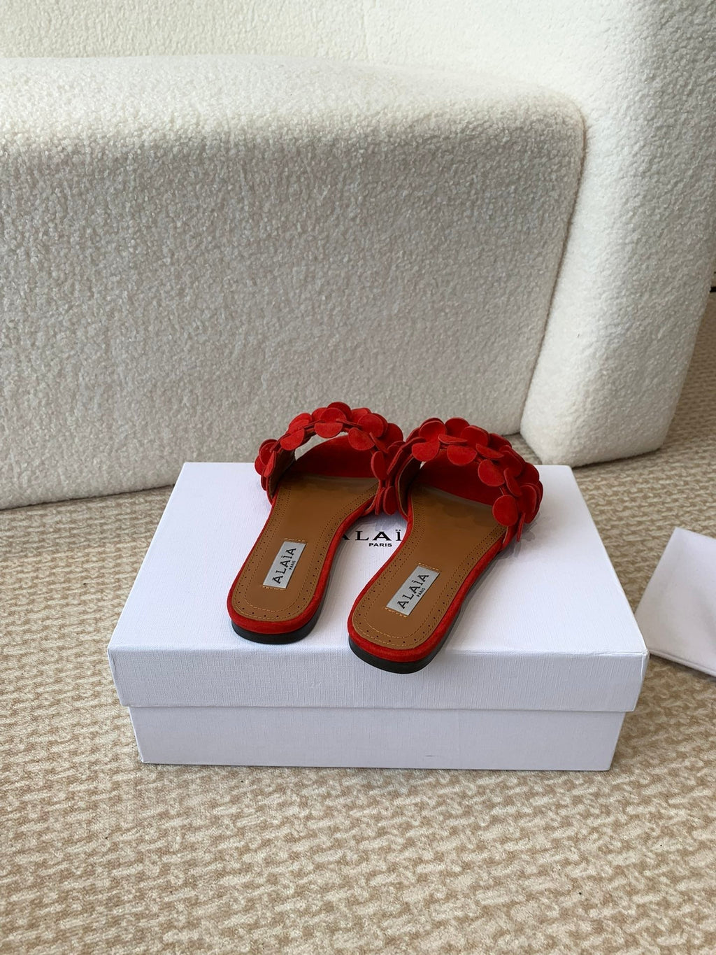 ALAIA FLAT MULE IN CHERRY RED SUEDE
