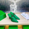 BOTTEGA VENETA ALFIE LEATHER HIGH MULES IN EMERALD GREEN CALFSKIN WITH WOVEN DESIGN