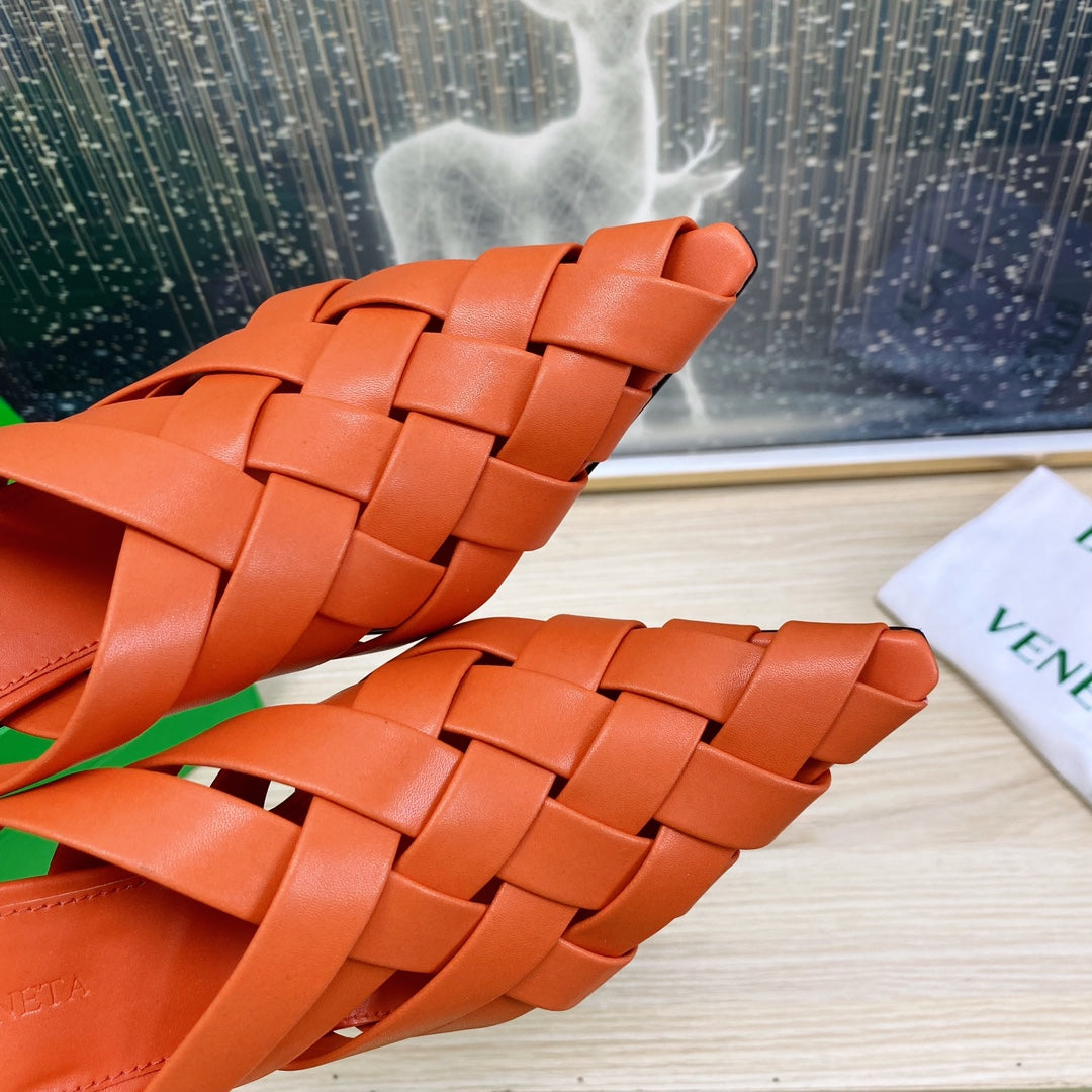 BOTTEGA VENETA ALFIE LEATHER HIGH MULES IN VIVID ORANGE CALFSKIN WITH WOVEN DESIGN