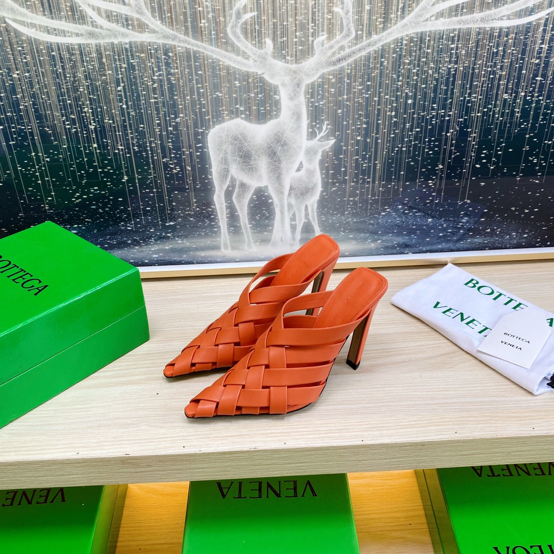 BOTTEGA VENETA ALFIE LEATHER HIGH MULES IN VIVID ORANGE CALFSKIN WITH WOVEN DESIGN