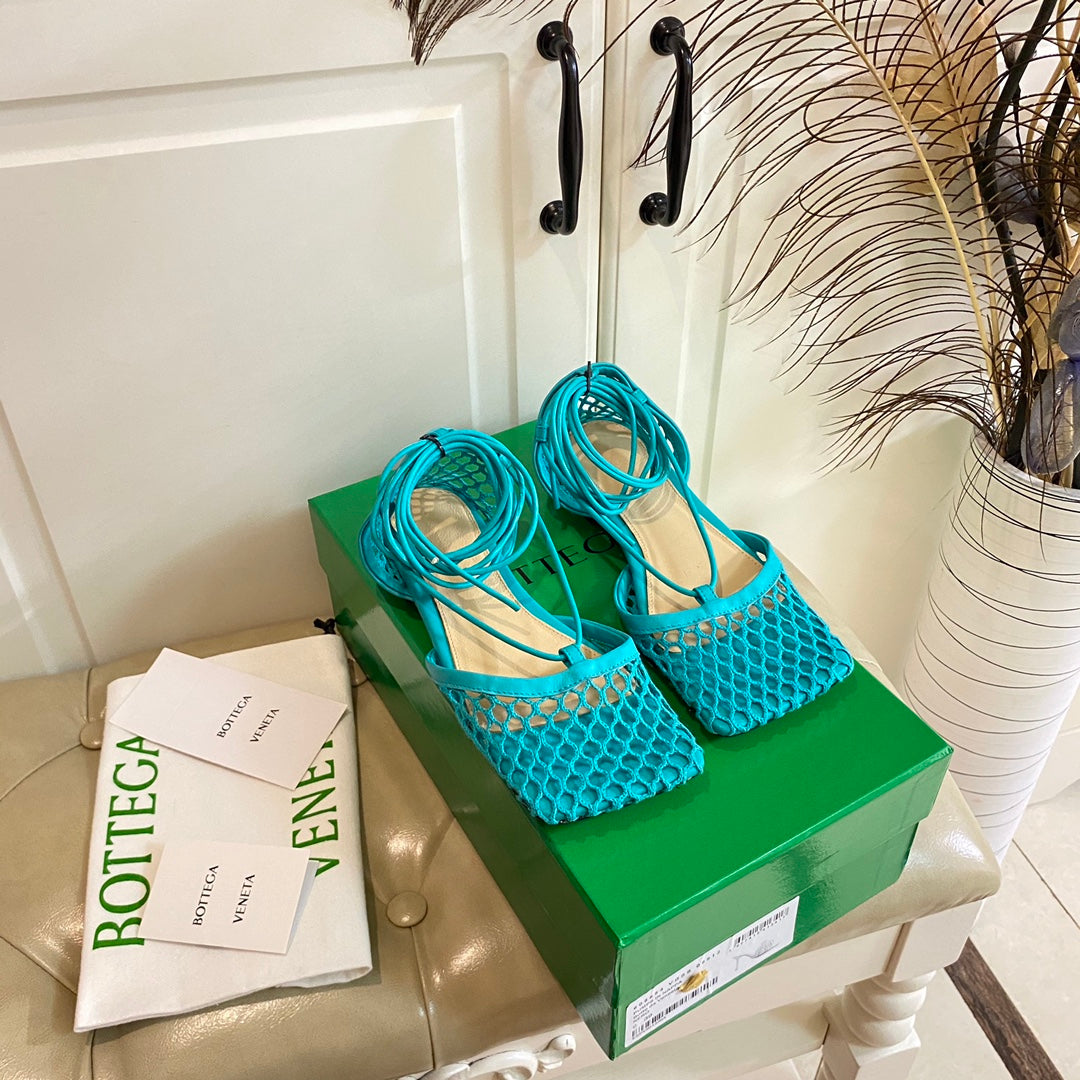 BOTTEGA VENETA STRETCH LACE-UP FLAT SANDAL IN CERULEAN BLUE METALLIZED MESH AND LEATHER