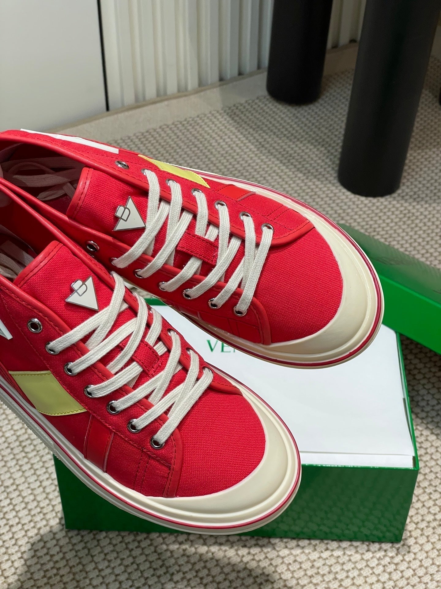 BOTTEGA VENETA ELIOT SNEAKER IN CHERRY RED CANVAS AND CALFSKIN