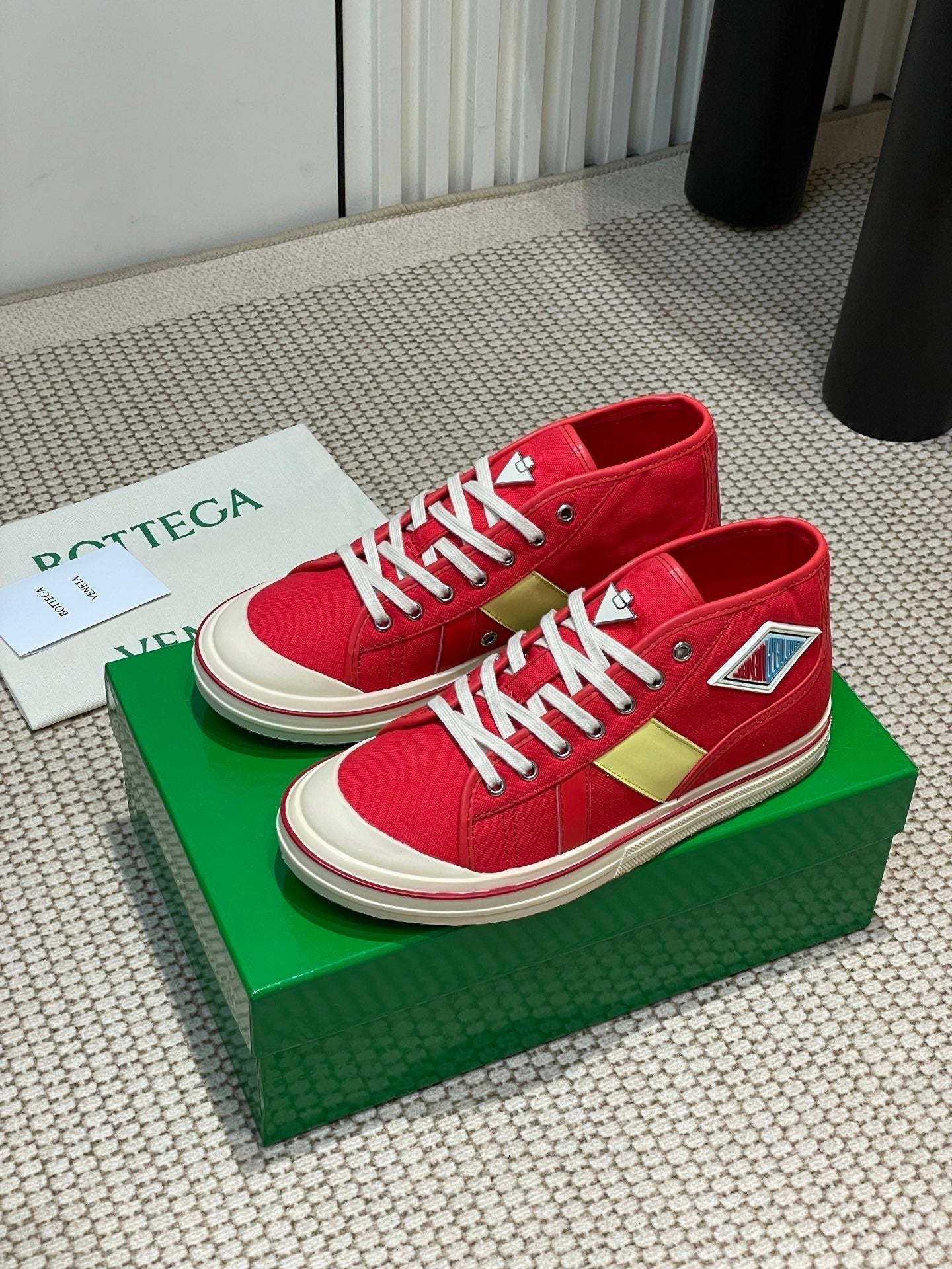 BOTTEGA VENETA ELIOT SNEAKER IN CHERRY RED CANVAS AND CALFSKIN