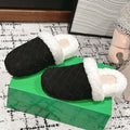 BOTTEGA VENETA REGGIE SLIPPER IN BLACK SUEDE AND SHEARLING LINING