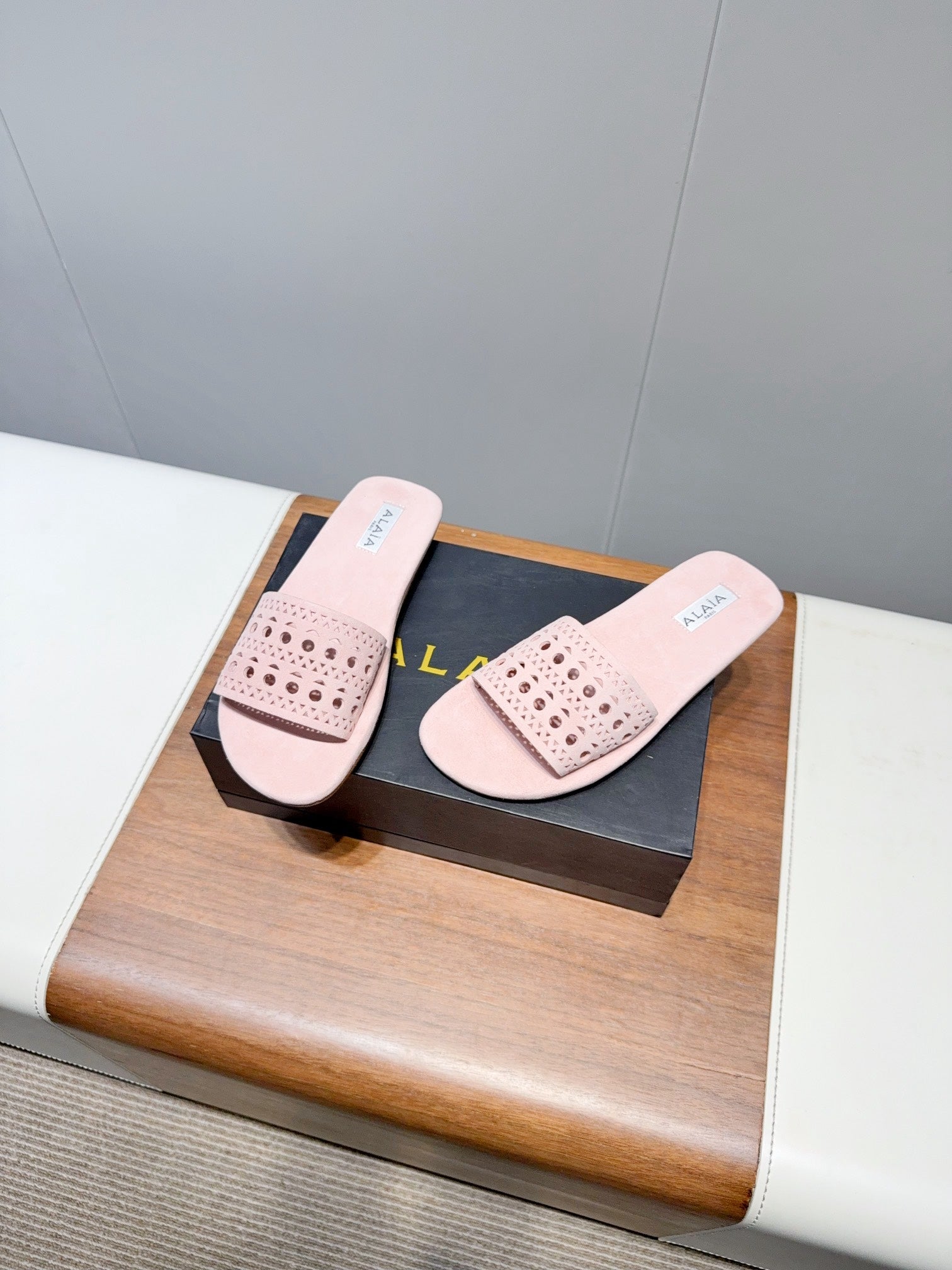 ALAIA FLAT SANDALS WITH PERFORATED STRAPS 25S IN LIGHT PINK SUEDE
