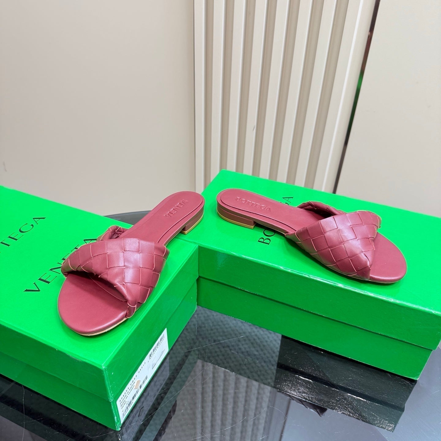 BOTTEGA VENETA BLINK FLAT MULE IN BERRY RED INTRECCIATO LEATHER