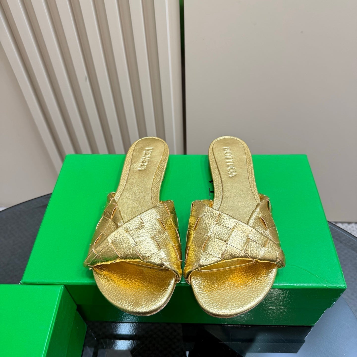 BOTTEGA VENETA BLINK FLAT MULE IN GOLD INTRECCIATO LEATHER