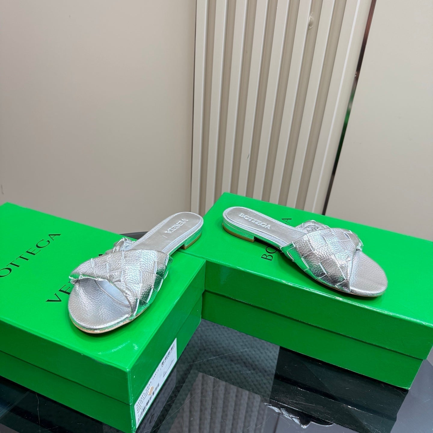 BOTTEGA VENETA BLINK FLAT MULE IN SILVER INTRECCIATO LEATHER