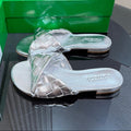 BOTTEGA VENETA BLINK FLAT MULE IN SILVER INTRECCIATO LEATHER