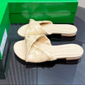 BOTTEGA VENETA BLINK FLAT MULE IN PALE YELLOW INTRECCIATO LEATHER