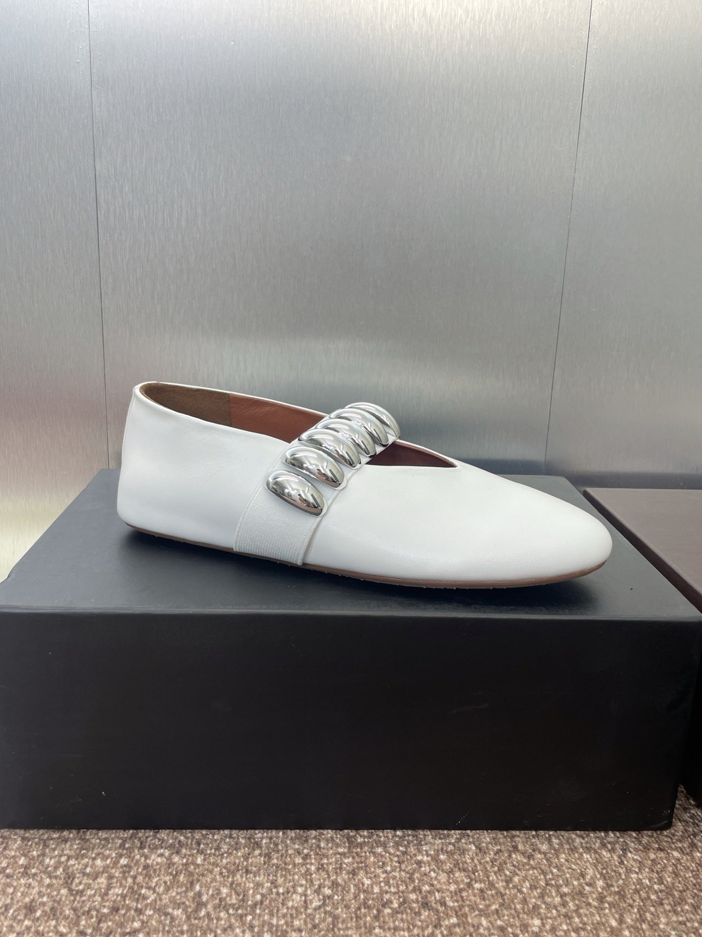 ALAIA MARY JANE FLATS 25S IN WHITE CALFSKIN WITH SILVER HARDWARE